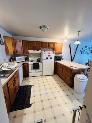 Private kitchen - Adirondack Townhome | Heated Pool + Foosball + Billiards | Uncas by AvantStay (North Creek)