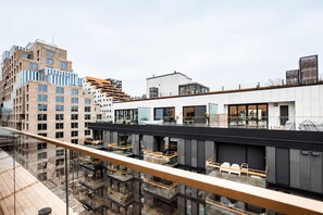 A modern building with multiple floors, large windows, and a glass balcony. - Luxury Penthouse | Sea Views & Terraces | 3 Bed, 2 Bath | Walk to Opera & MUNCH (Oslo)