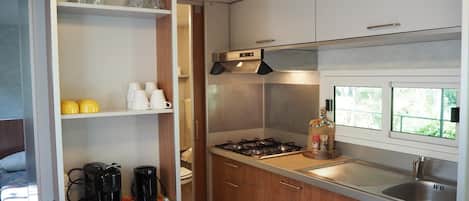Fridge, stovetop, coffee/tea maker, dining tables