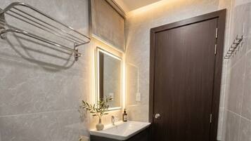 Shower, hair dryer, slippers, towels