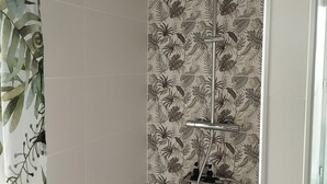 A shower with a vertical rain showerhead, a handheld showerhead, and a wall-mounted control panel. - La Canissa Carrada family canopy room (Chaspuzac)
