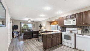 A kitchen with a central island, built-in microwave, oven, and dishwasher. - View of Table Rock Lake - Minutes from SDC - PERFECT! (Branson)