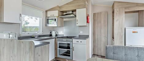 Refrigerador, horno, parrilla de estufa y tostadora