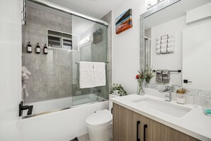 Hair dryer, bidet, towels, soap - Driftwood Den- Family 2BR Basement suite near White Rock Beach (Surrey)