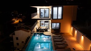 A two-story house with a swimming pool, a balcony, and a staircase. - Just 500 Meters to the Beach: Sea View, Private Pool, 10-Guest Villa in Kışla (Antalya)