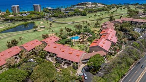 An aerial view of a resort with multiple buildings, a golf course, and a swimming pool. - 2BR, 2BA Kaanapali Royal condo with pool, hot tub, kitchen, AC-Kaanapali Royal F302 (Lahaina)