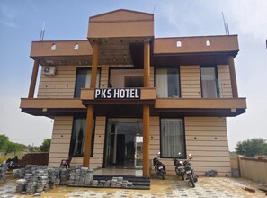 A two-story building with a sign reading 'PKS HOTEL.' - PKS Hotel & Family Restaurant (Shri Madhopur)