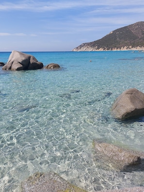 A clear coastal water body with large rocks and a distant hill. - Villa Relax hot tub with panorama, about m. 300 from the beach (VILLASIMIUS)