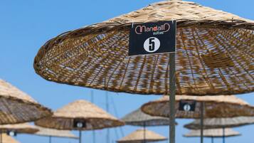 Beach nearby, white sand, sun loungers, beach umbrellas