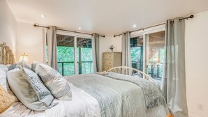 A bedroom with a bed, a dresser, and a window with curtains. - Hike, Golf & Explore: Extended Stay in Camp Meeker (Occidental)