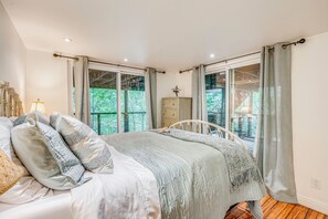 A bedroom with a bed, a dresser, and a window with curtains. - Hike, Golf & Explore: Extended Stay in Camp Meeker (Occidental)