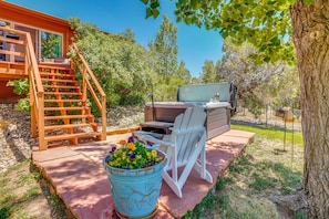 A patio with a wooden staircase, outdoor seating, a grill, and a potted plant. - Beach, Hot Tub & Mtn Views! Dolores Couple's Gem (Cortez)