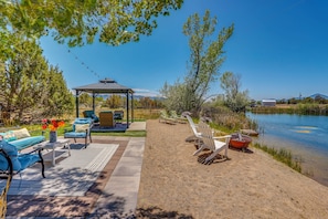 A patio with outdoor furniture, a gazebo, and a lake view. - Beach, Hot Tub & Mtn Views! Dolores Couple's Gem (Cortez)