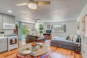 A compact living space with a kitchenette, dining area, and a bed. - Beach, Hot Tub & Mtn Views! Dolores Couple's Gem (Cortez)