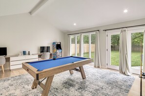A pool table in a room with a large window, a desk, and a television. - Game Room! Upscale Family Retreat in Murfreesboro (Murfreesboro)
