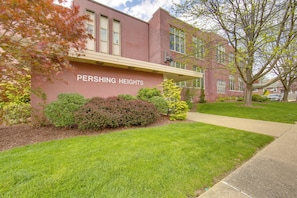 A building with a sign reading "PERSHING HEIGHTS" and a well-maintained lawn in front. - Work, Play & Explore: 9-unit New Kensington Base (New Kensington)