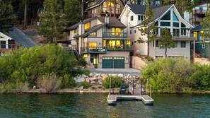 A waterfront property with a dock, multiple-story houses, and a river. - 5-STAR Lakefront cabin with AMAZING mountain & lake VIEWS! DOCK & GAME ROOM! (Big Bear Lake)