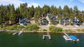 A lakeside residential area with houses, docks, and boats. - 5-STAR Lakefront cabin with AMAZING mountain & lake VIEWS! DOCK & GAME ROOM! (Big Bear Lake)