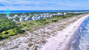A coastal area with a beach, a road, and a residential area with houses. - Gulf View Pool | Deeded Beach Access | Jubilation | Sleeps 11, Boat Parking (Pot St Joe)