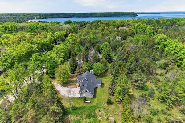 Welcome to Cottage on the Hill! Just 0.8 miles from downtown Ephraim, this aerial view looks west toward scenic Eagle Harbor and the village waterfront-putting Door County's shops, restaurants, and breathtaking sunsets just minutes from your doorstep
