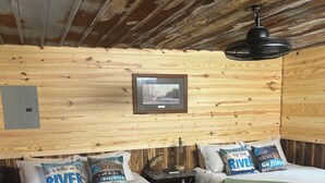 A cabin-style room with two beds, a framed picture on the wall, and a ceiling fan. - River and Refuge Retreat!!!!Cozy 2-bedroom cottage in delightful Columbia NC (Columbia)