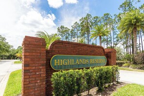 A brick entrance with a sign reading 'Highlands Reserve.'