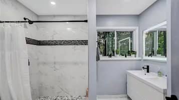 Shower, hair dryer, towels, soap