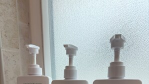 Three bottles of Native hair care products on a windowsill. - Comfort in the Cape (Cape Coral)