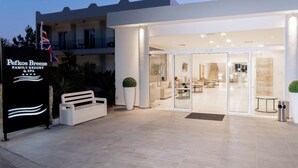 A modern building with a sign reading 'Pefkos Breeze Family Resort & SPA'. - Pefkos Breeze Family Resort & Spa (Rhodes)