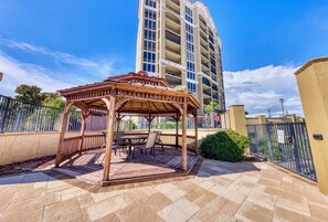 Outdoor dining - This penthouse, 12th floor center, is a ocean front condo with full coastal view (Gulfport)