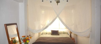Arco Iris Farm surrounded by mountains and nature in the Sacred Valley Vilcabamba