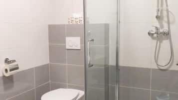 Shower, free toiletries, towels, toilet paper