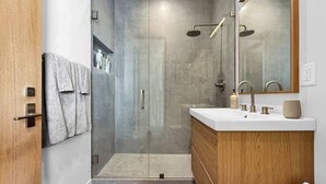 Shower, hair dryer, towels, shampoo