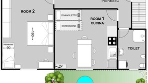 Ein Grundriss mit zwei Zimmern, einer Küche, einer Toilette und einem Eingangsbereich.