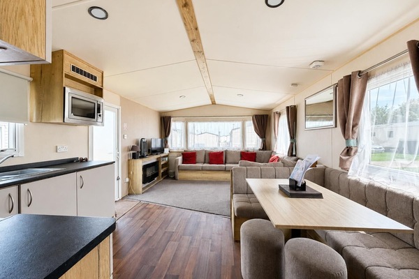 The large open plan lounge with its L shaped sofa is the perfect place to get the family together to discuss the day. They will love being able to plan your next adventure on the coast in Suffolk.