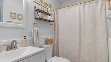 Shower, towels, soap, toilet paper