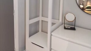 A white wardrobe with a mirror and a hanging rack. - Apartment in Belfast City (3) (Belfast)