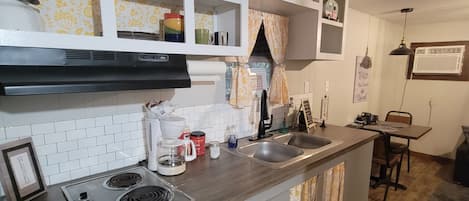 Fridge, microwave, stovetop, coffee/tea maker