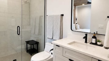 Shower, hair dryer, towels, shampoo
