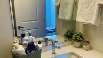 Shower, towels, soap, toilet paper
