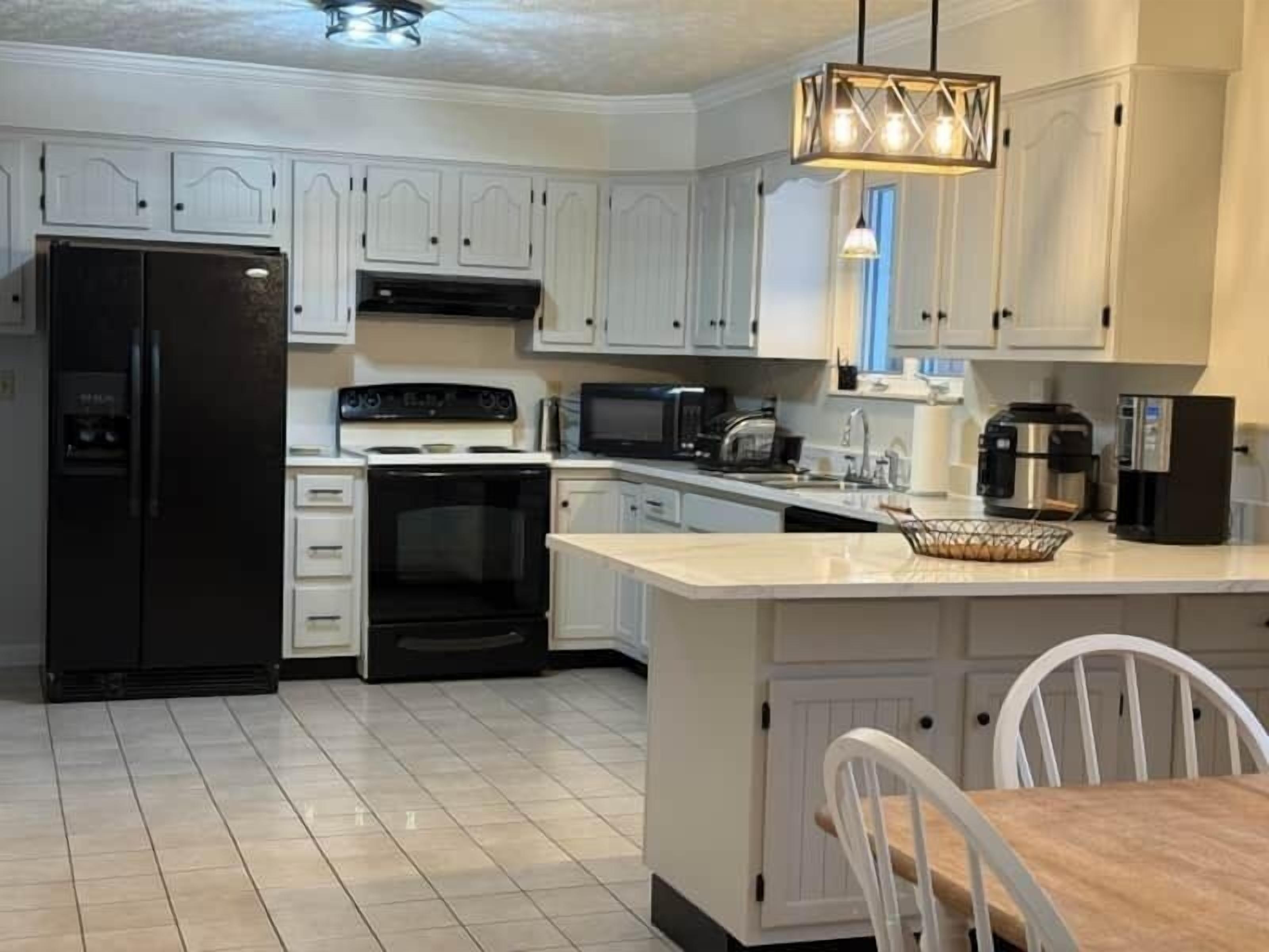 Coffee/tea maker, fridge, microwave, oven