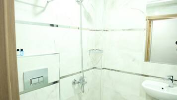 Economy Double Room, City View | Bathroom | Combined shower/tub, hair dryer, towels, soap