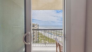 A balcony with a view of the beach and ocean. - Pinnacle Peace 707-Gulf Views-Sleeps 4 (Panama City Beach)