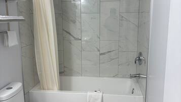 Combined shower/bathtub, hair dryer, towels, soap