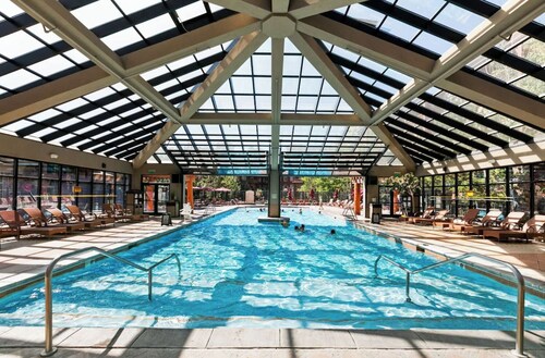 Mountain resort condo with ski access, spa, gym, dining and adventure.