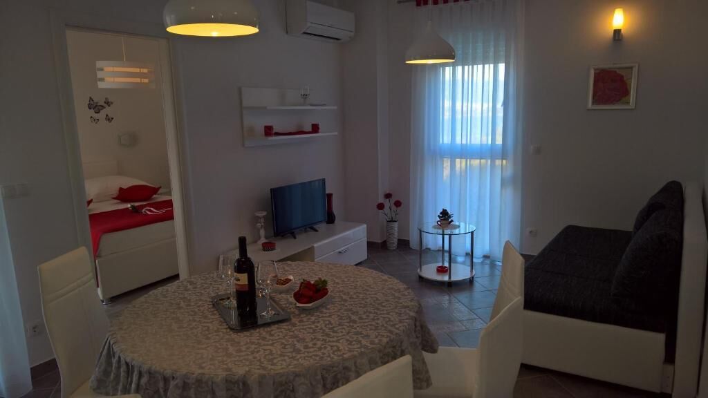 Apartment, Balcony, City View | Living area | Flat-screen TV