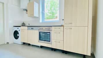 Mini-fridge, oven, stovetop, cookware/dishes/utensils