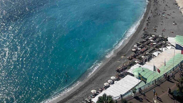 A coastal cityscape with a beach, buildings, and a clear sky. - Nice Old Town 3BR Duplex - AC, Easy Check-in, Cathedral Area (Nice)