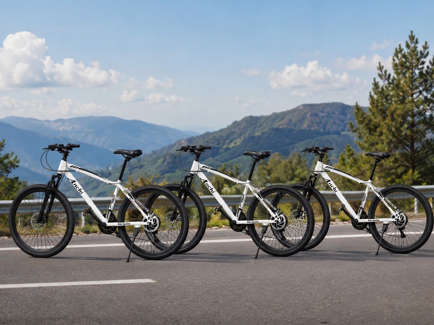 Three bicycles parked on a road with a mountain view in the background.
