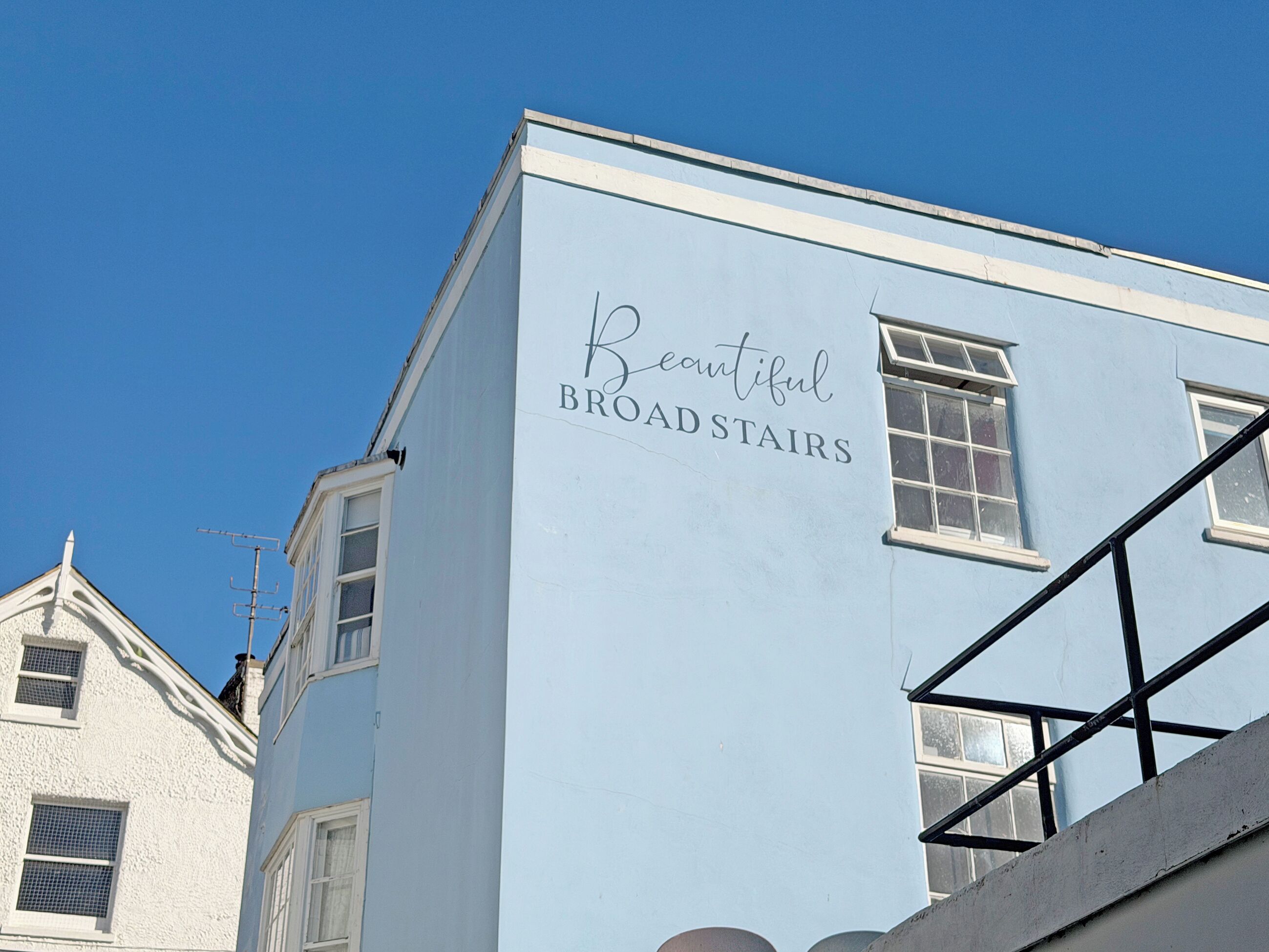 A building with a sign reading 'Beautiful BROAD STAIRS.'